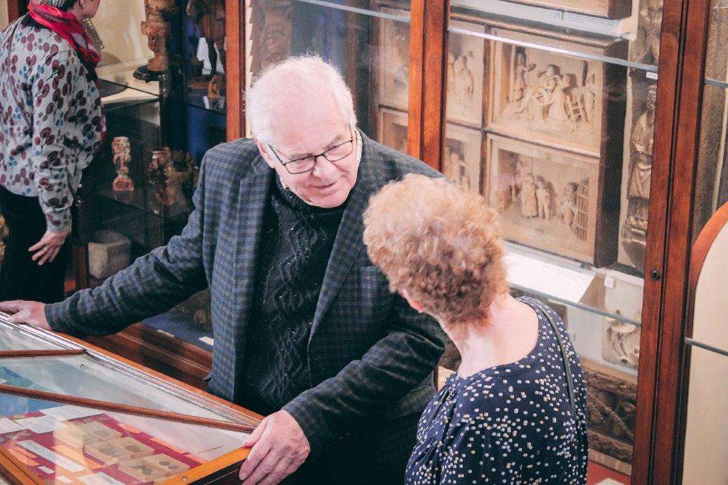 Two visitors discuss the exhibits